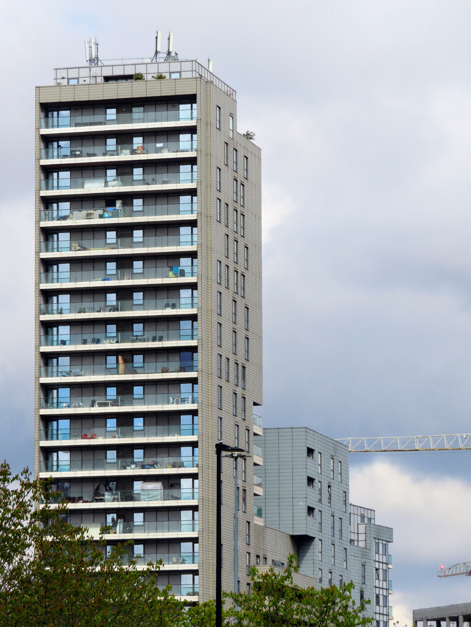 A Tall Building Under Cloudy Sky